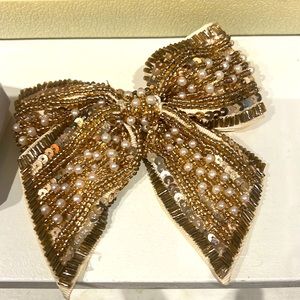 CARA New York sequin Bow pin